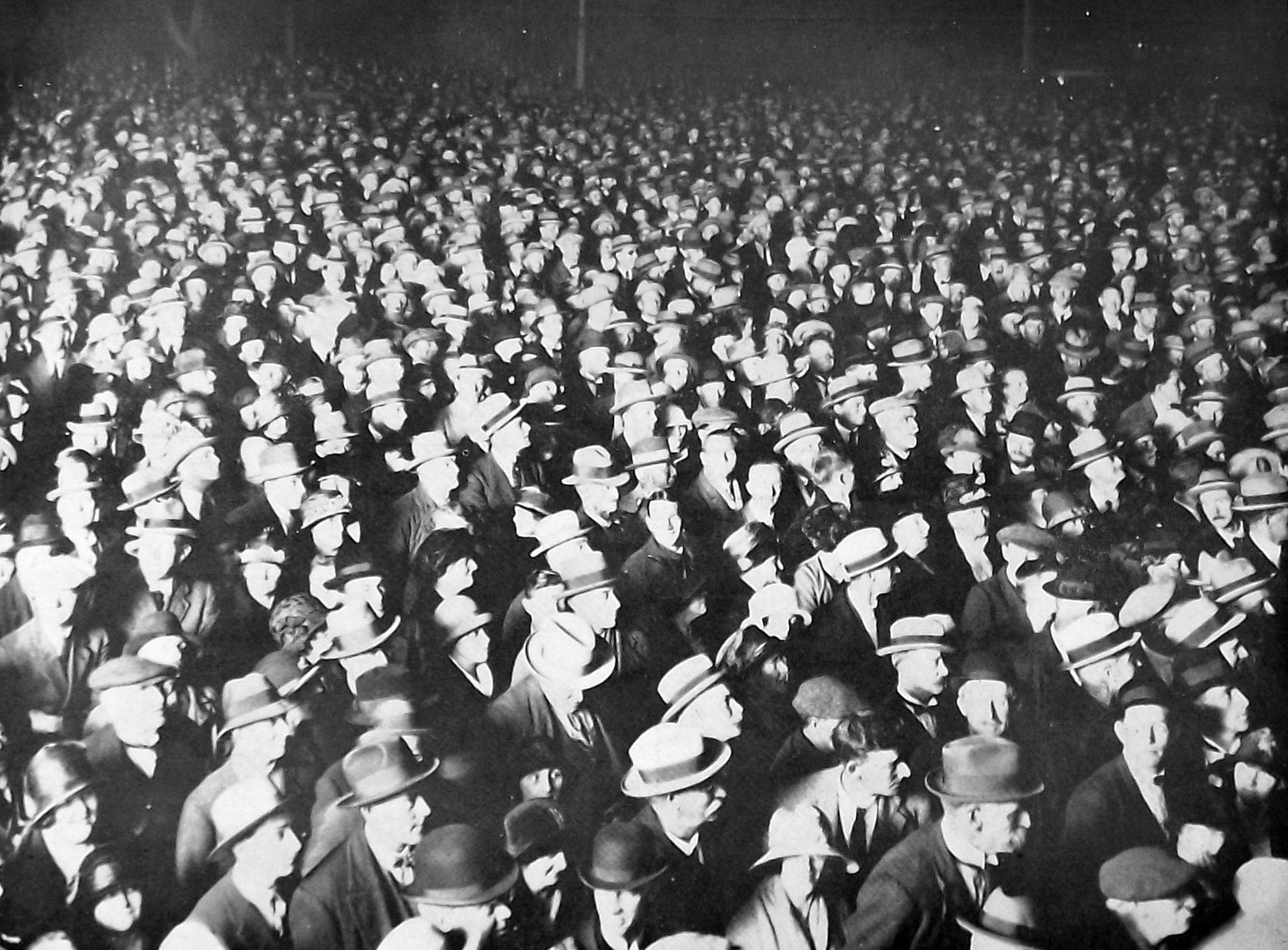 Crowds jostle outside the Otago Daily Times and Witness Co office in Dunedin, awaiting the...