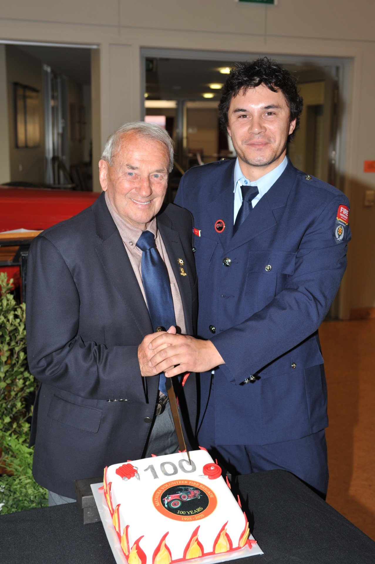 It would not be a hundred years without a cake, with oldest living life member Neville...