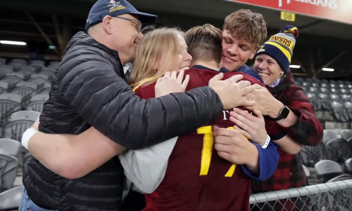 Fabian Holland celebrates with his family — they had been kept apart by Covid for nearly two...