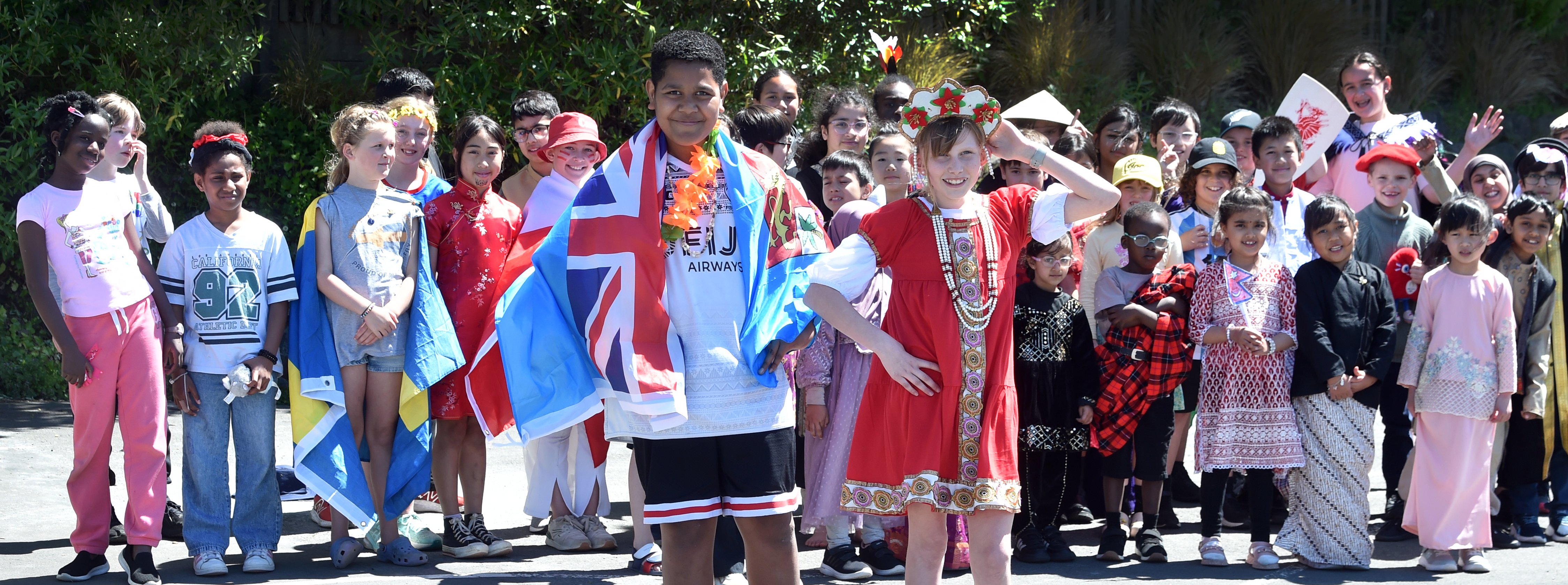 George Street Normal School pupils Ledua Qera, 11 (left), and Nika Cooney, 10, dress in the...