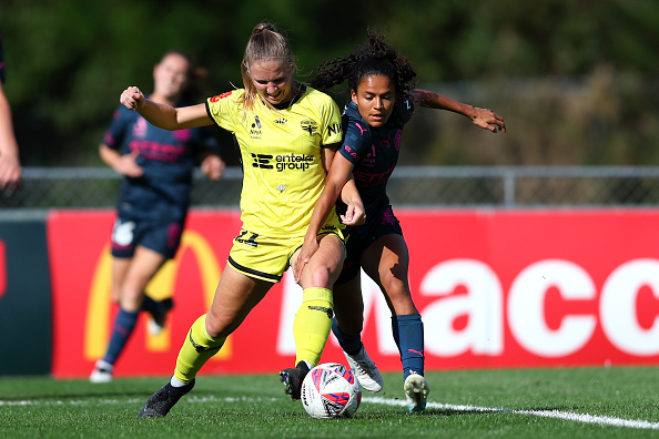Wellington Phoenix defender Lara Wall competes for the ball with Melbourne City’s Lourdes Bosch...