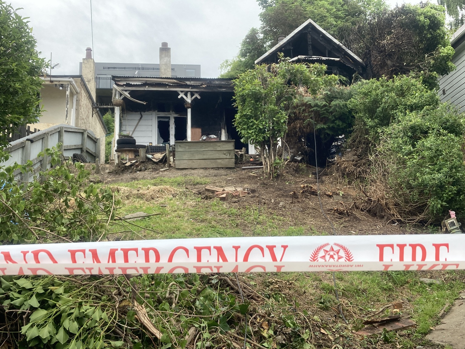 The fire-damaged house in Lees St, Dunedin, on Tuesday morning. PHOTO: STEPHEN JAQUIERY