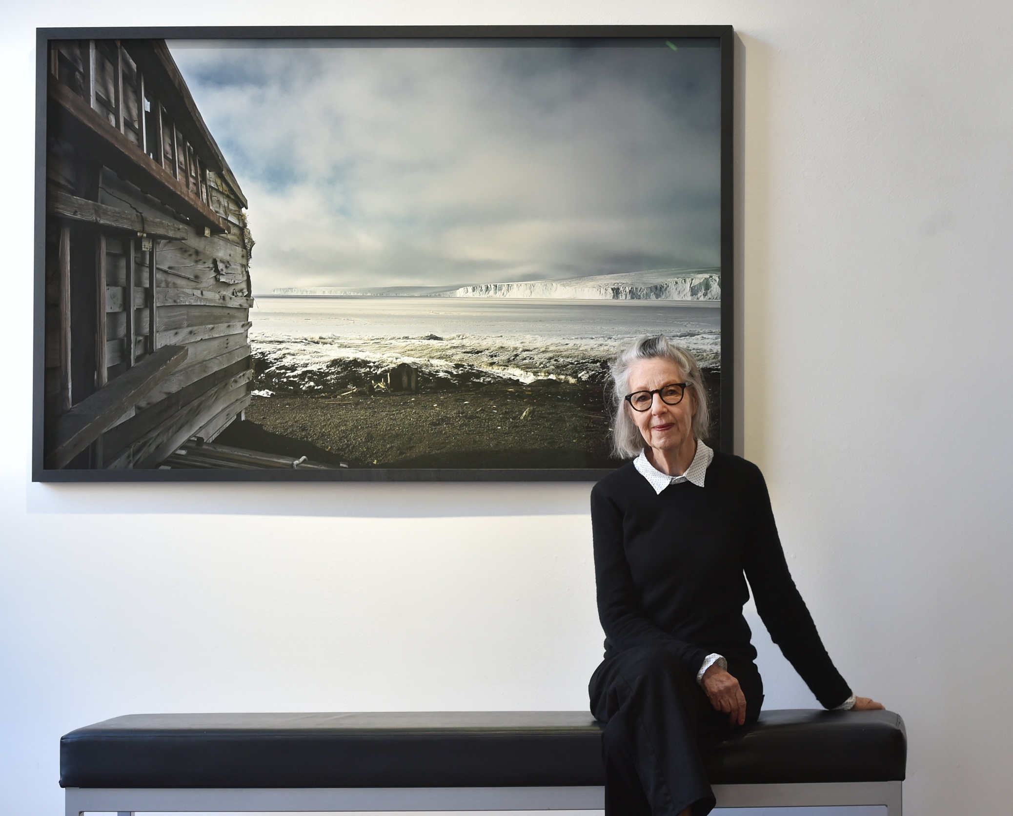 Photographer Jane Ussher in front of her Scott's Hut Cape Evans 1, 2008 1/5, one of her works...