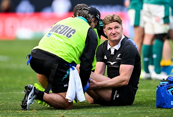 Jordie Barrett gets treated for an injury during the All Blacks match against Ireland on Sunday...