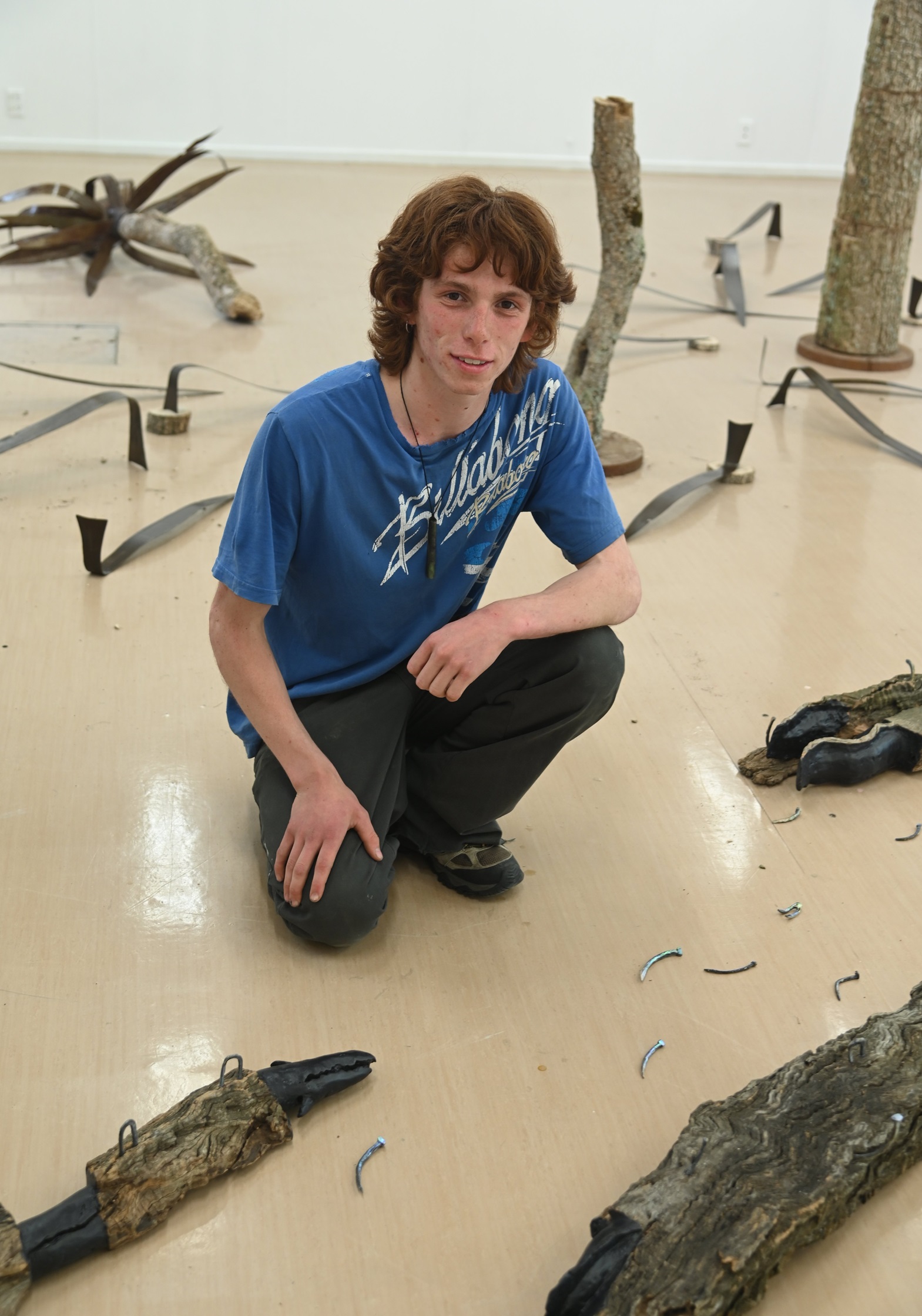 Kahu Kaan puts together his exhibition for SITE. Photo: Craig Baxter