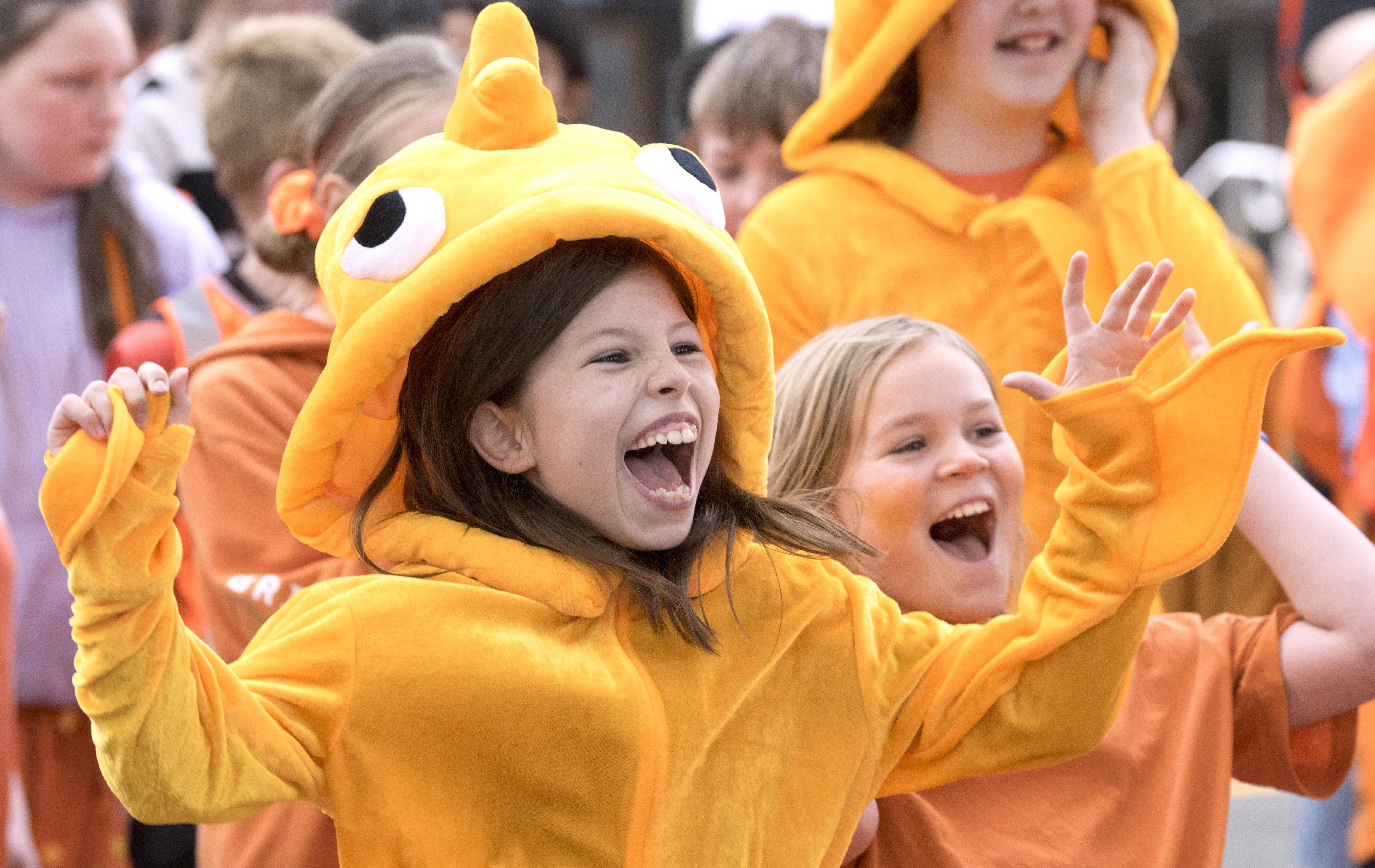 St Clair School pupils Zeta McDowell-Ross (left) and Sydney Pomerleau, both 10, cheer as their...