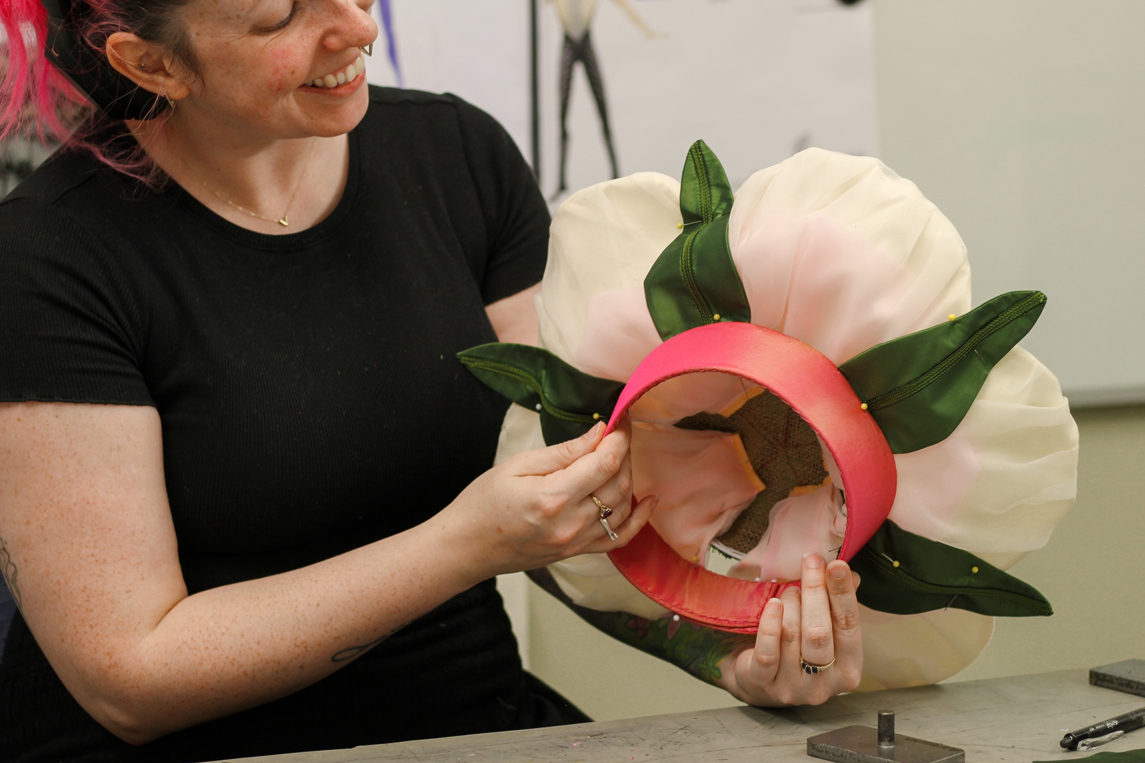 Grindley works on the mānuka flower hat for the Waltz of the Flowers. Photo: RNZB
