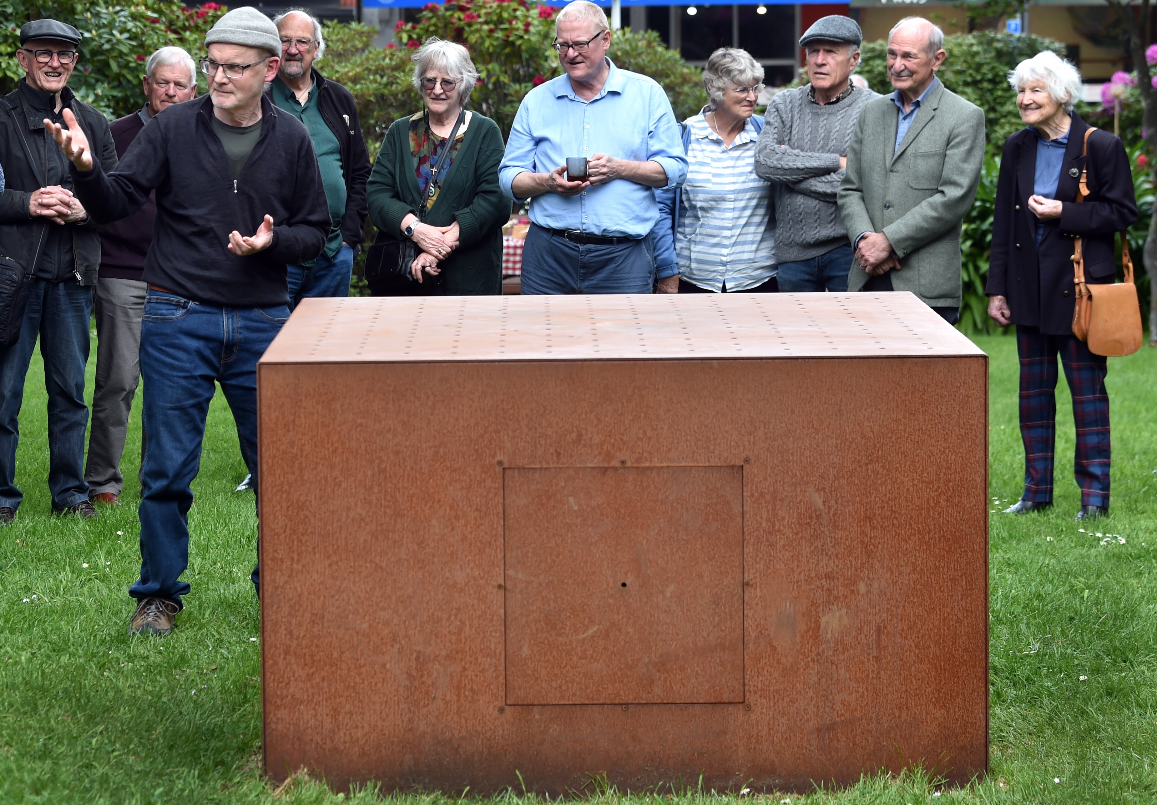 Artist Mike O’Kane explains his new work, 'Mercy Falls Like Gentle Rain', to an audience at Knox...