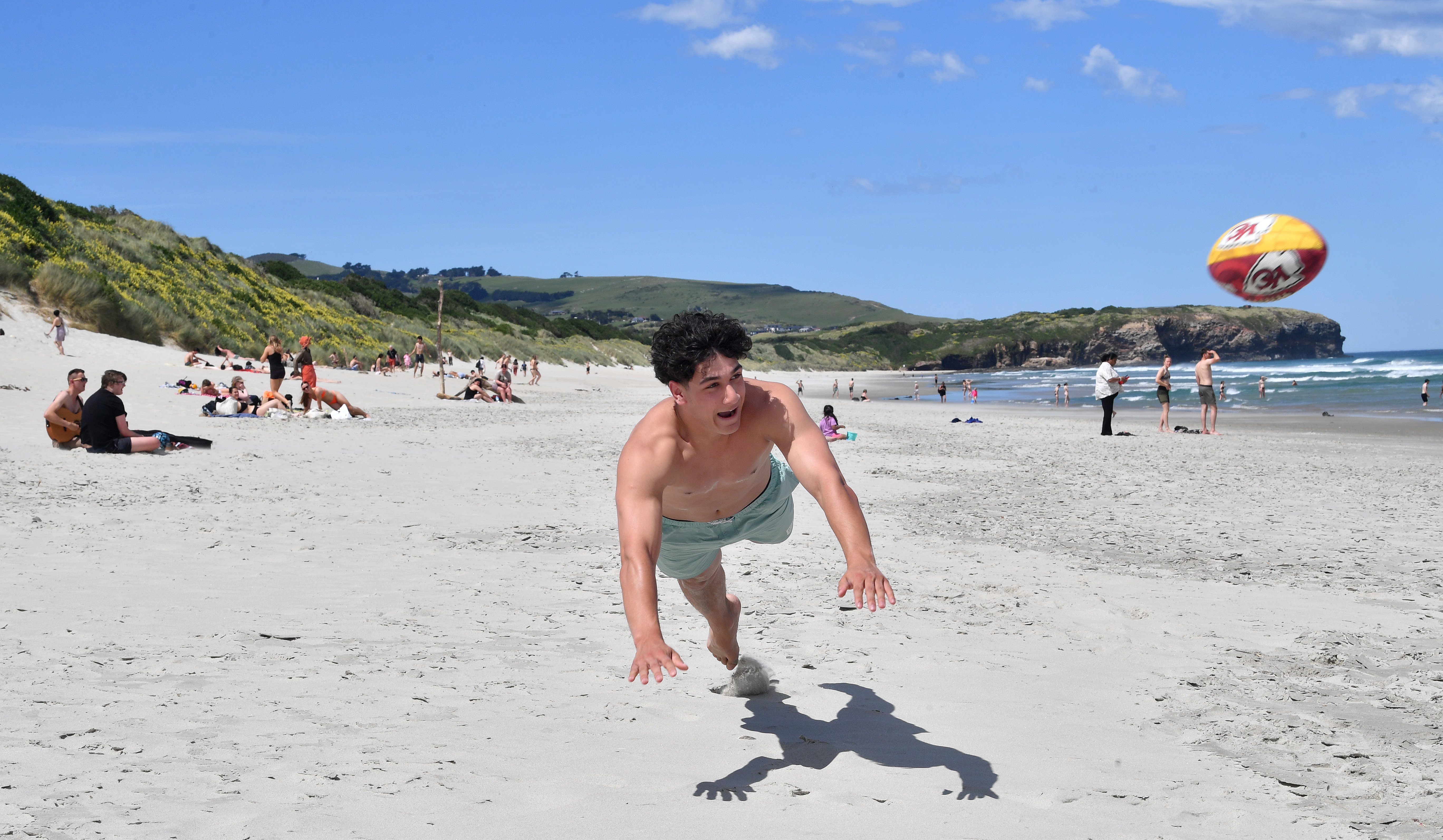 Otago Boys’ High School 2025 graduate Yusuf Nagdee, 18, dives while attempting to catch a Kansas...