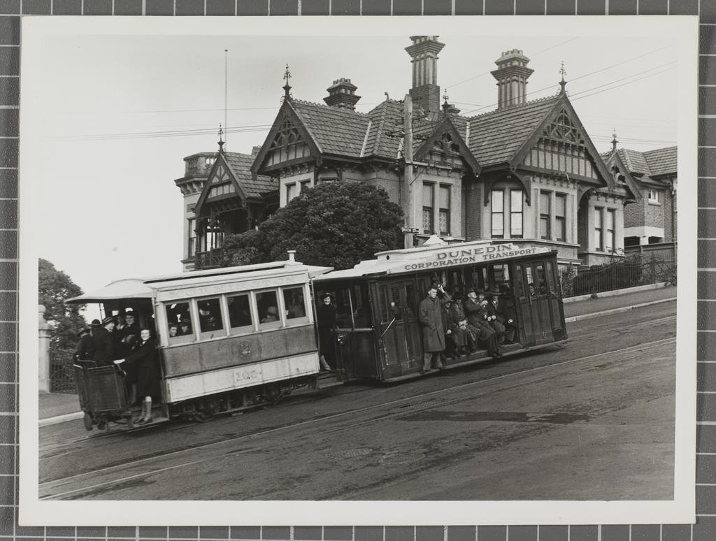 Commuters on the Mornington cable car as it passes "Threave" in High St, Dunedin sometime in the...