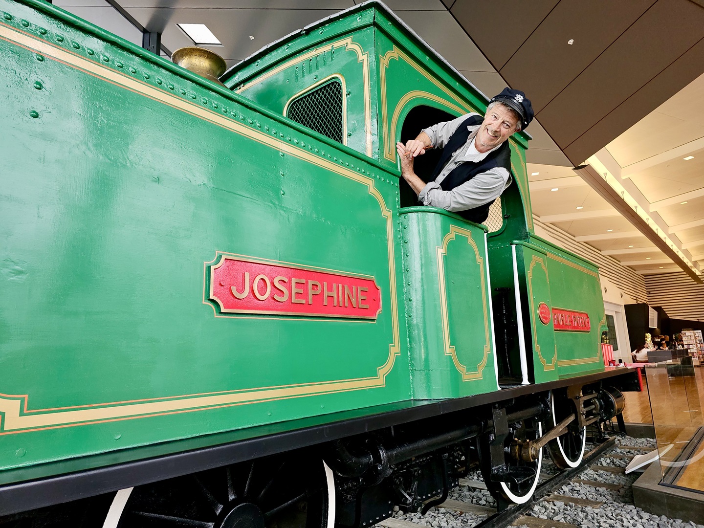 Signwriter Shem Southerland refreshes livery detailing to the historic locomotive Josephine in...