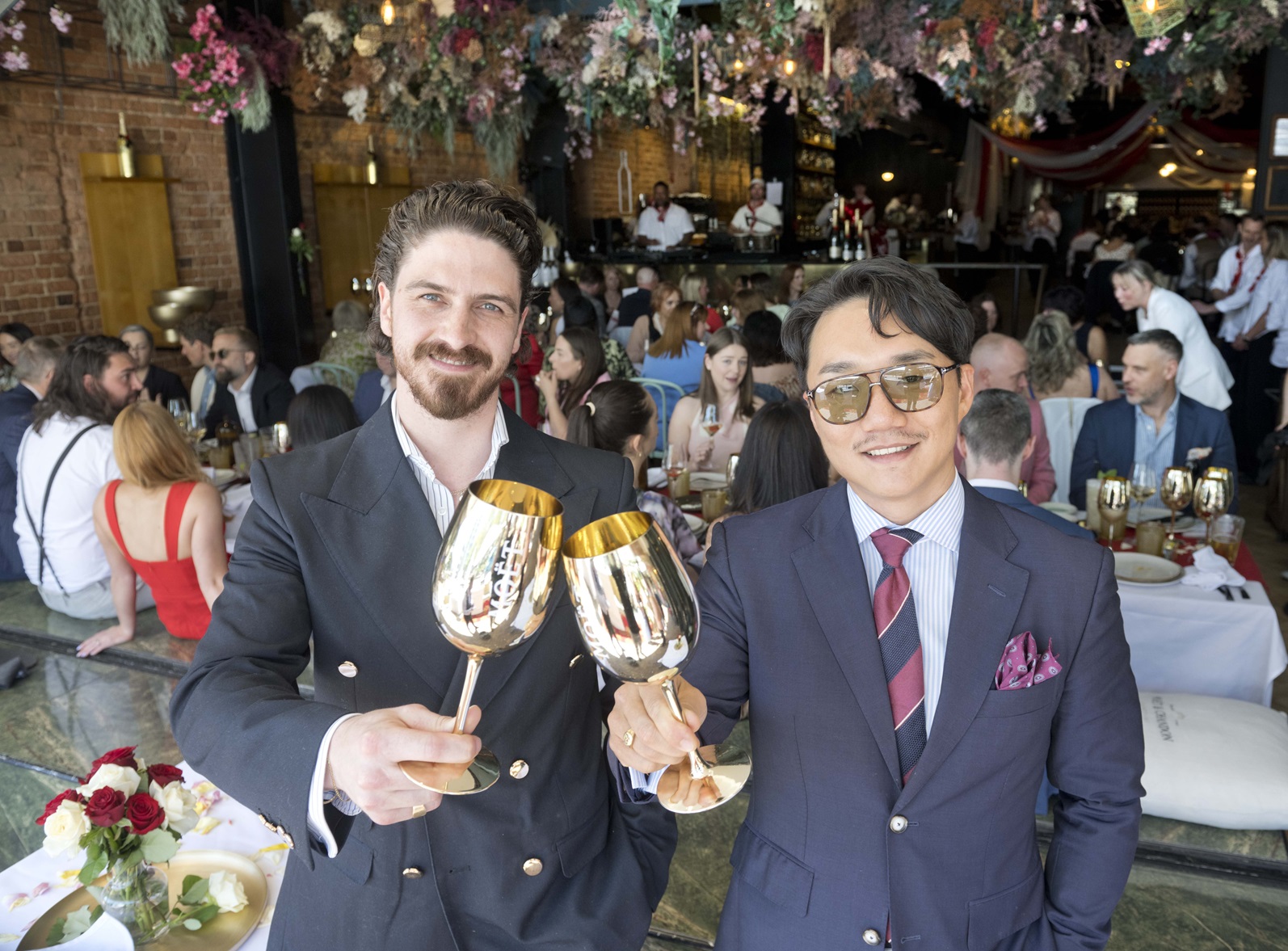 Vault 21 operations manager Max Gillies (left) and owner Andre Shi toast guests at the Dunedin...