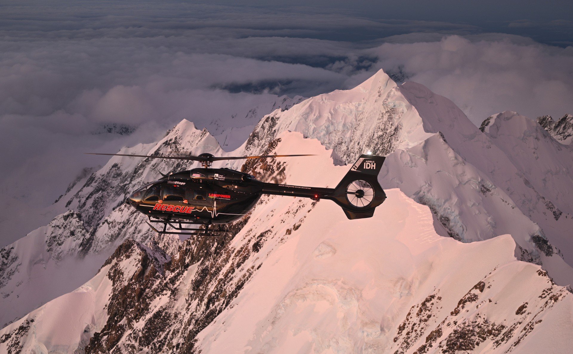 The ridge, visible just behind the tail rotor, on Aoraki/Mt Cook where two climbers were rescued....