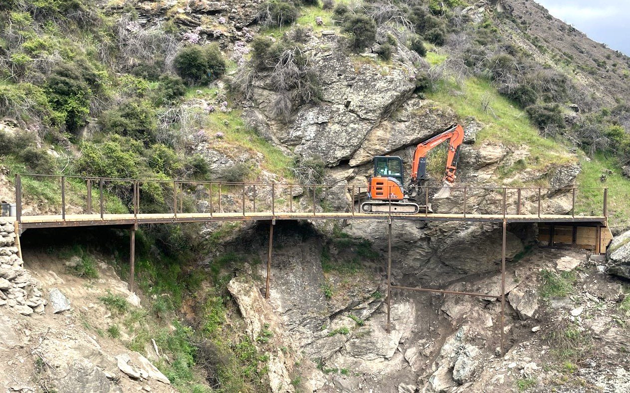 A five-tonne digger crosses a bluff bridge on the under-construction Kawarau Gorge Trail. PHOTO:...
