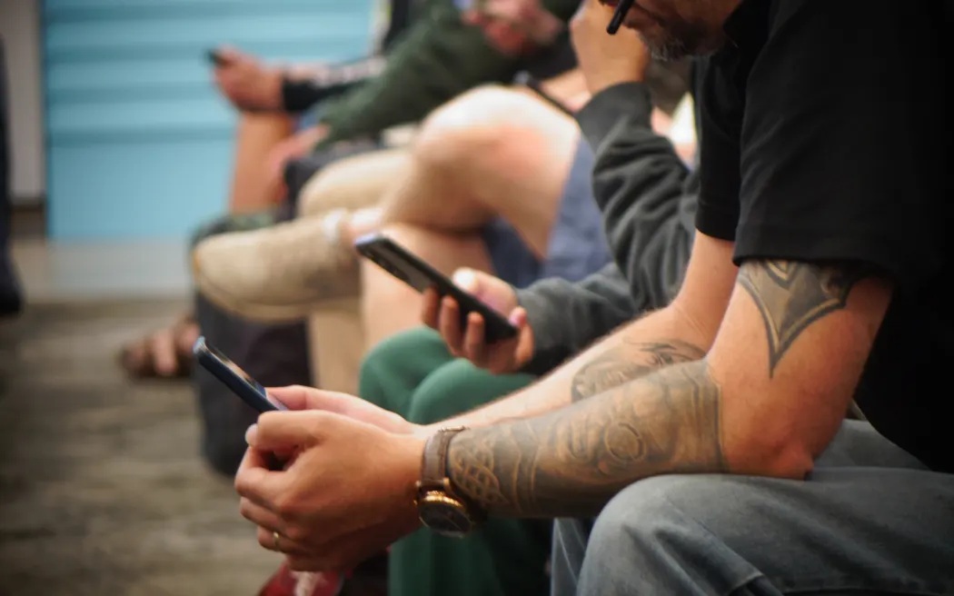 Passengers killing time at Auckland Airport on Friday. Photo: RNZ