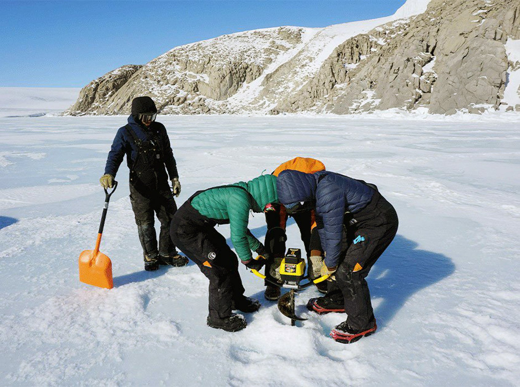 University of Otago marine scientist Dr Sarah Seabrook and her team drill through the sea ice in...