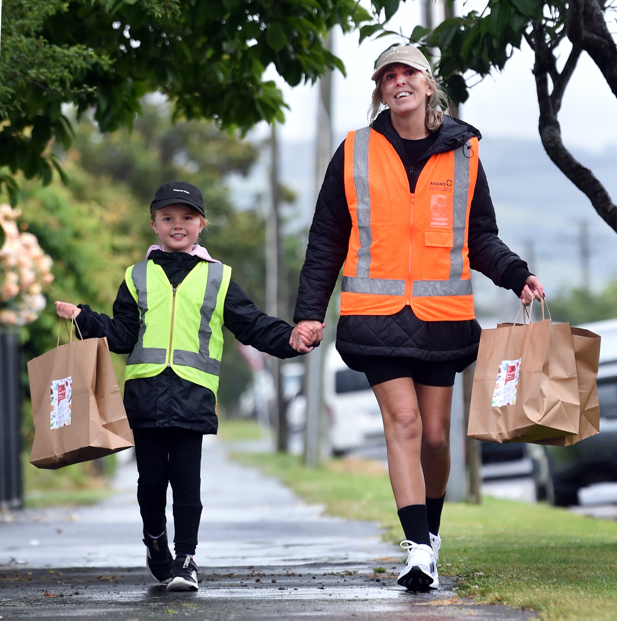 Emmie, 6, and Kirst Beadle collect food parcels during the Mosgiel Area Can and Food Drive last...