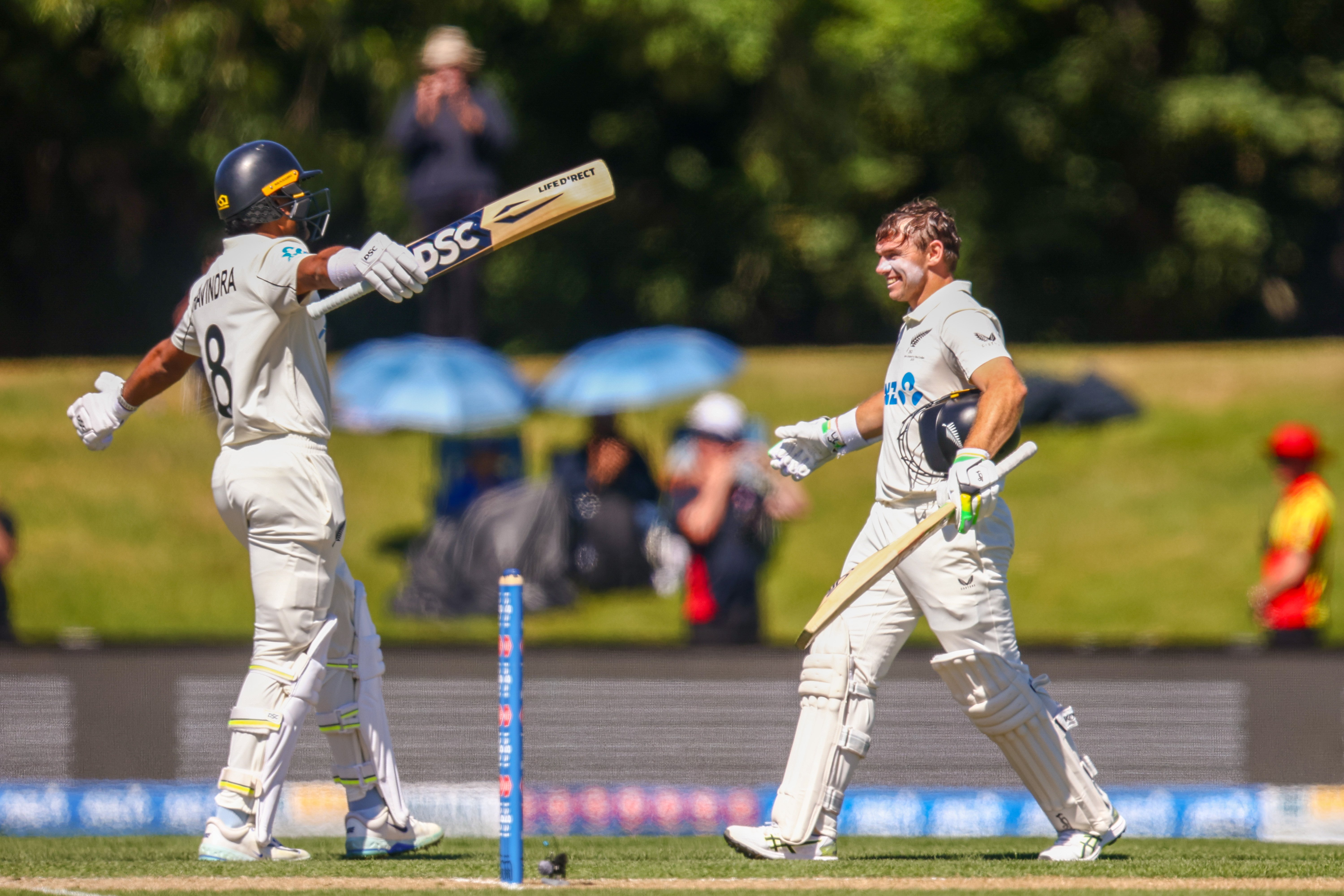 The Black Caps’ Rachin Ravindra (left) congratulates Tom Latham on his century during day three...