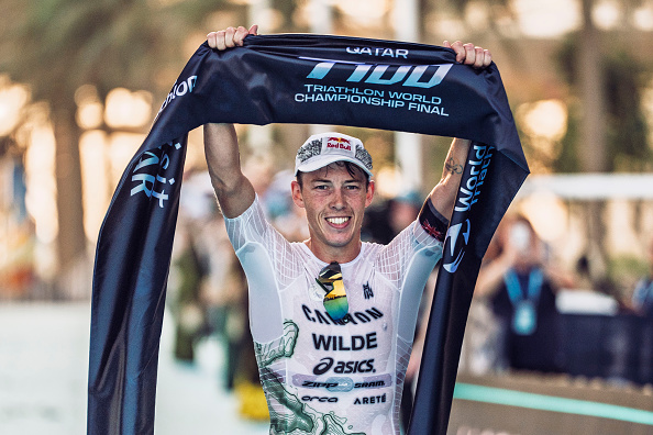 Hayden Wilde celebrates in Qatar. Photo: T100 Triathlon via Getty Images