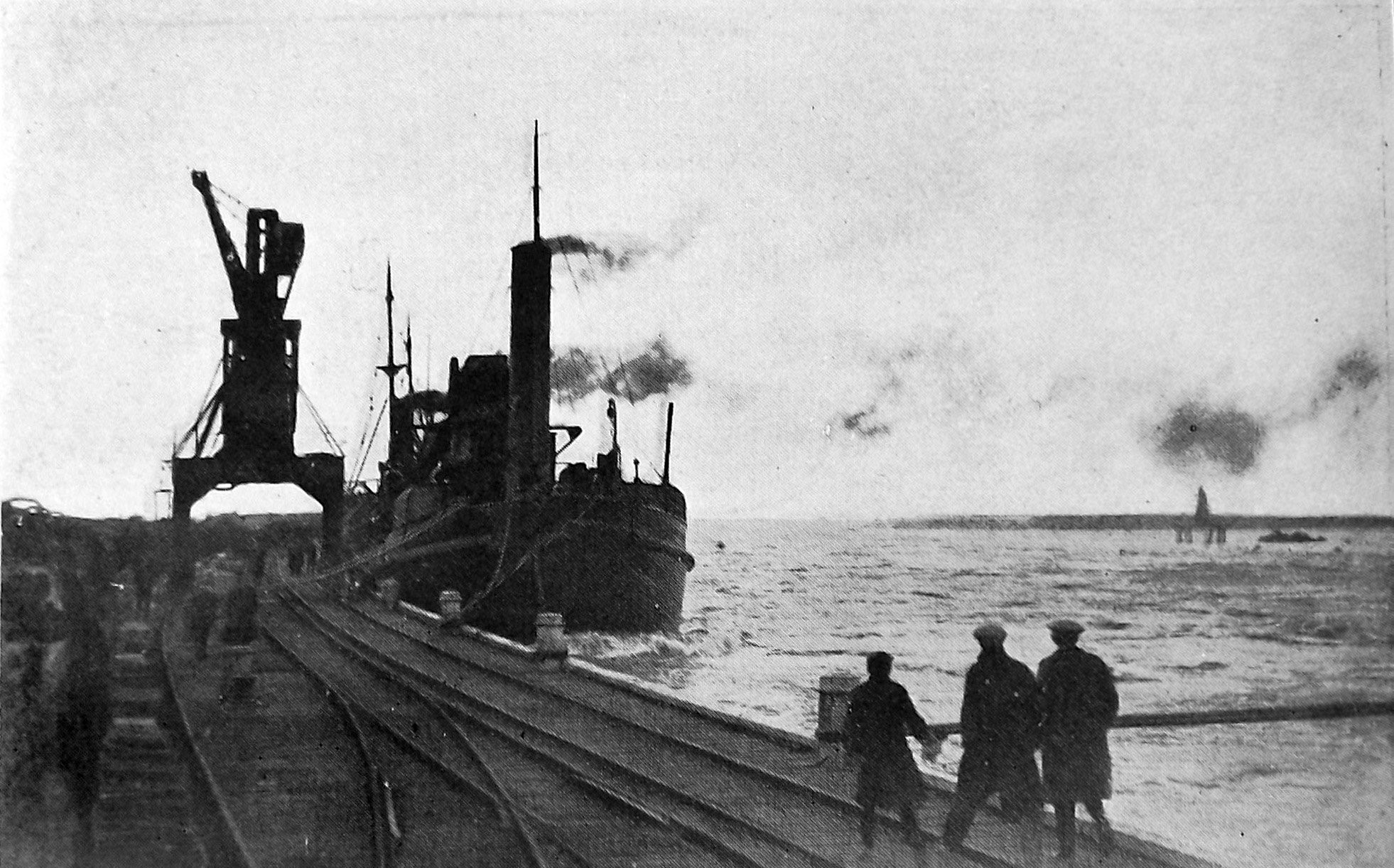 A ship berthed on the Greymouth wharf steams at half-speed-ahead to counteract the swift current...