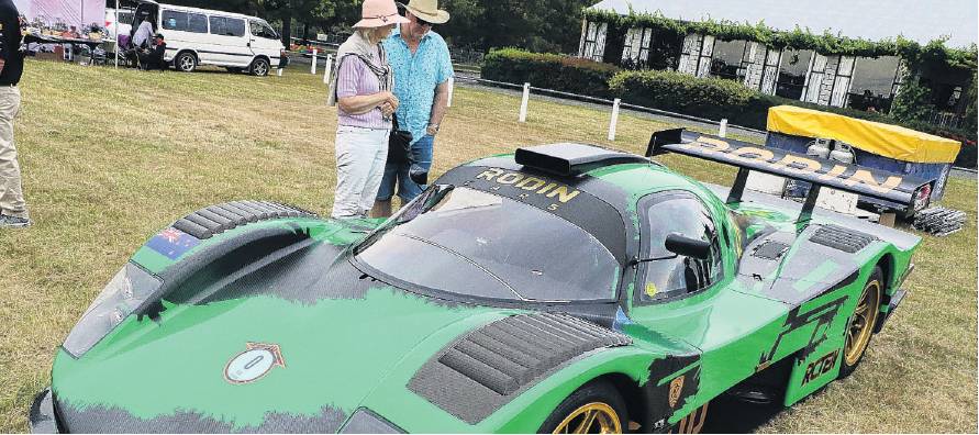 Ian and Penelope McKee look over the Rodin Cars Sintura race car on show at the Hawarden-Waikari...