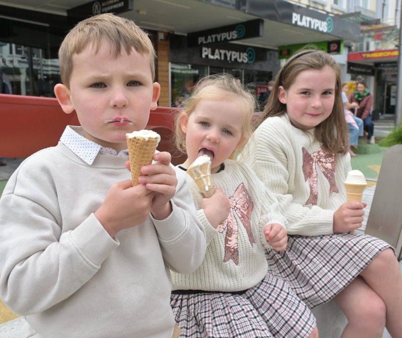 Fergus Mckenzie (5), left, Clara Mckenzie  (3) and Eliot McKenzie (8), enjoy their ice-creams...