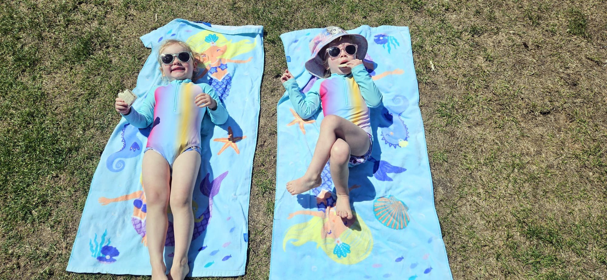 Last summer's winning photograph shows twins Peyton and Harper Lobb, 3, enjoying some summer sun...