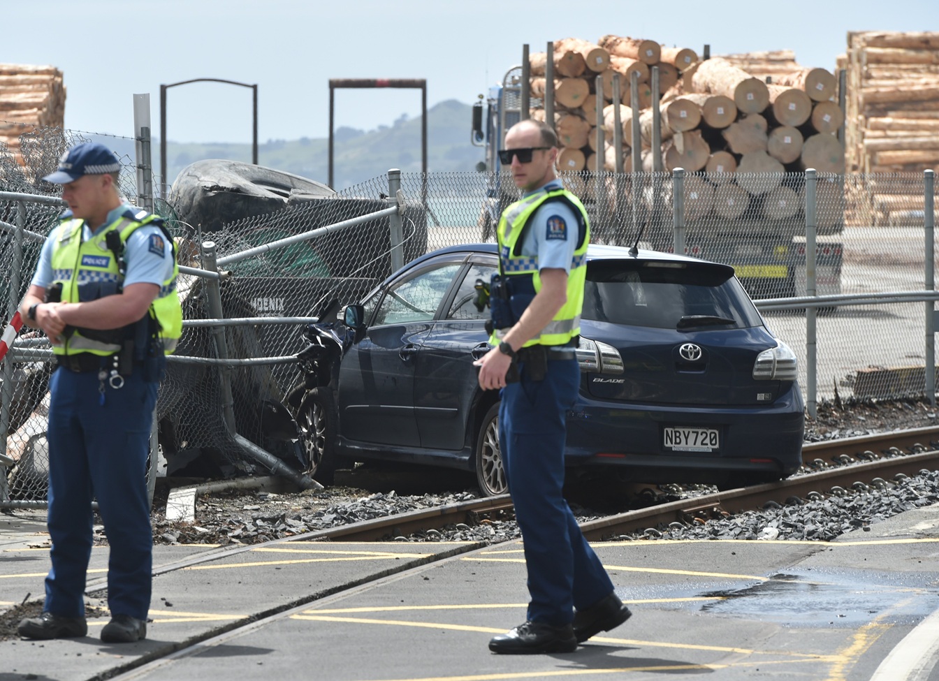 Police officers at the scene of the crash in Beach St, Port Chalmers. Photo: Gregor Richardson
