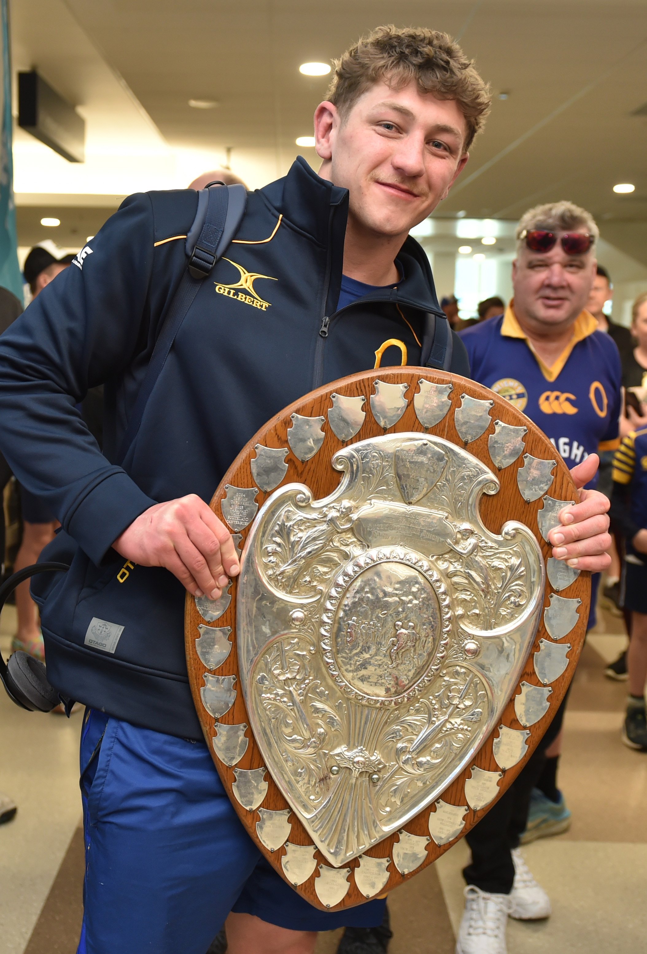 Otago flanker Lucas Casey holds the Ranfurly Shield after a successful challenge in September....