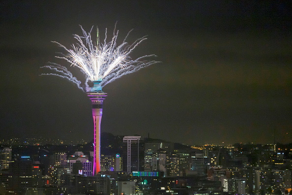 Fireworks ignite from the Sky Tower in Auckland on New Year's Eve 2021. Photo: Getty Images