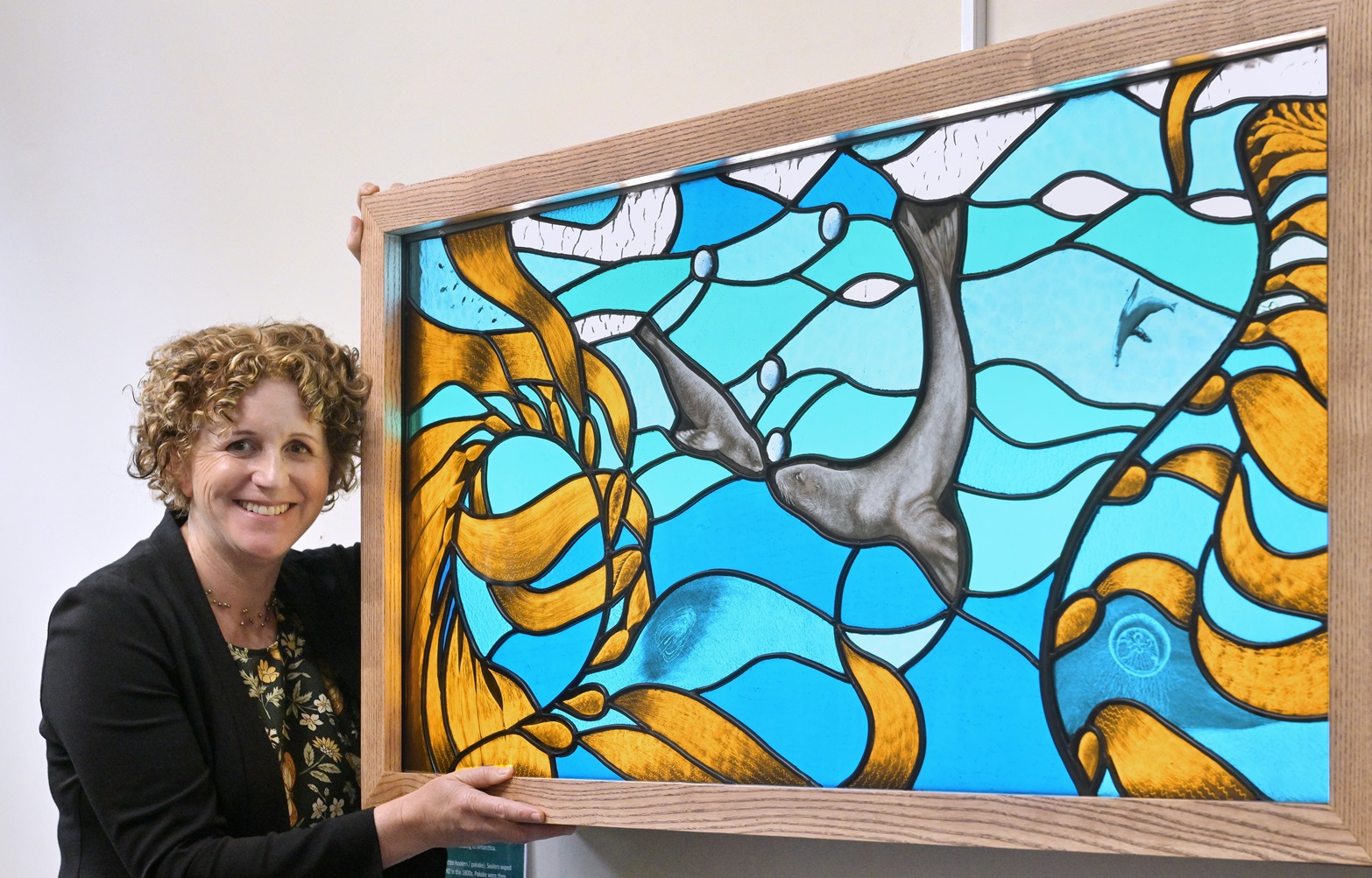 University of Otago marine science professor Ceridwen Fraser holds her stained-glass artwork that...
