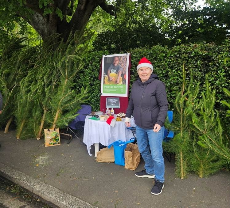 Long-serving Christmas tree sale volunteer Pauline Norris, pictured with a selection of trees...