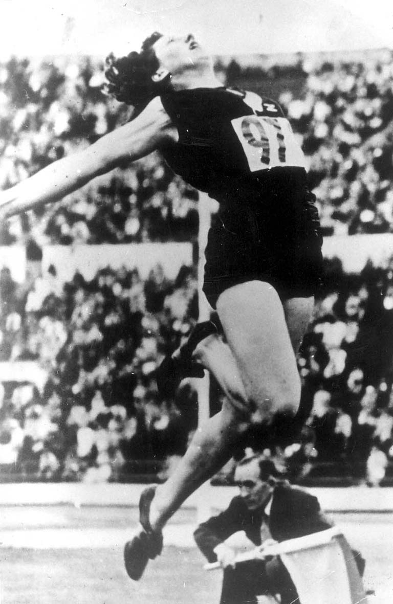 Williams on her way to winning the 1952 Olympic long jump gold medal. PHOTOS: ODT FILES