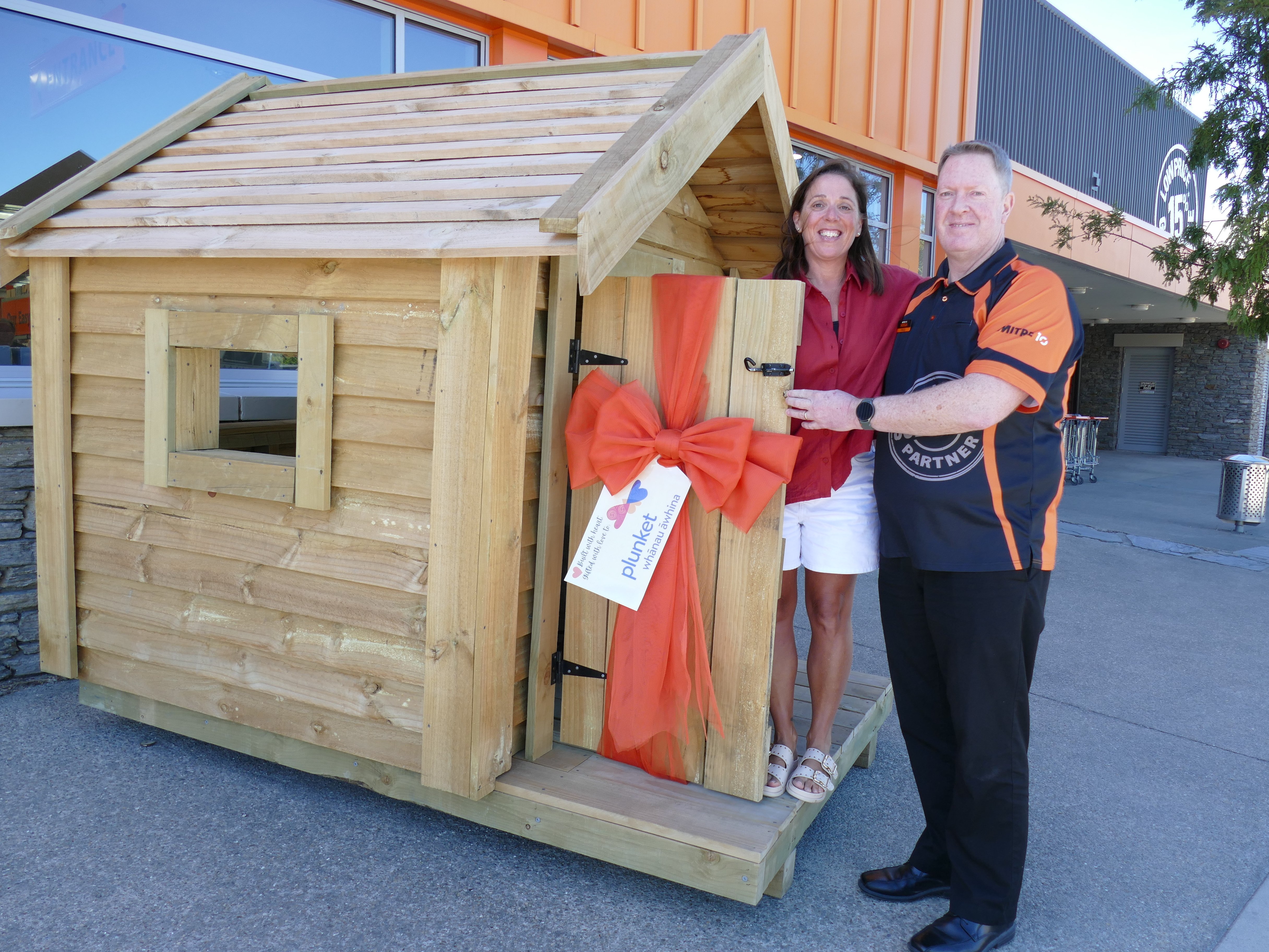 Wakatipu Plunket’s Tanya Moffat is pictured with local Mitre 10 Mega GM Paul Jackson and the...
