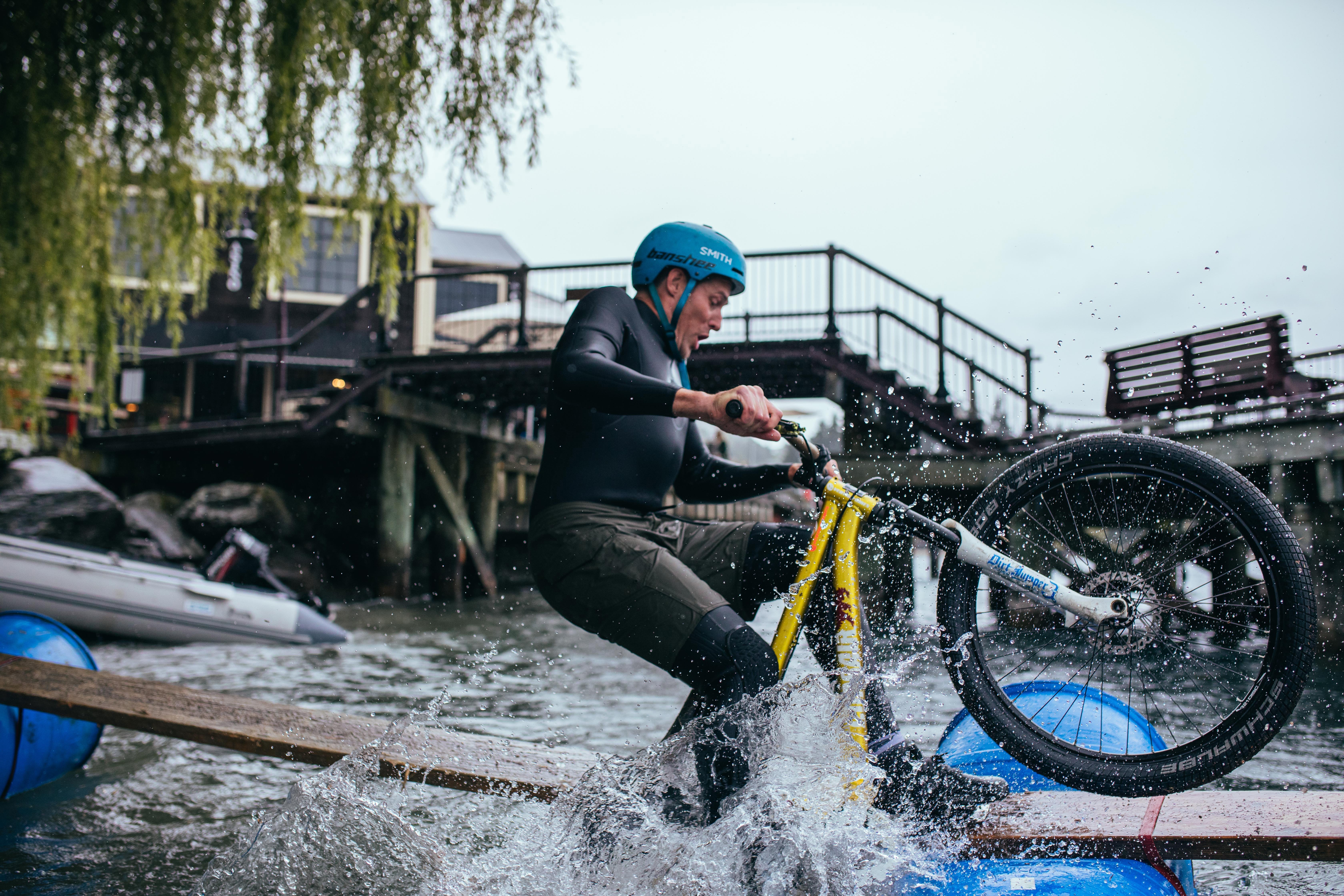 Queenstown Bike Fest co-organiser Emmerson Wilken has a go at the log race during the 2024 event....