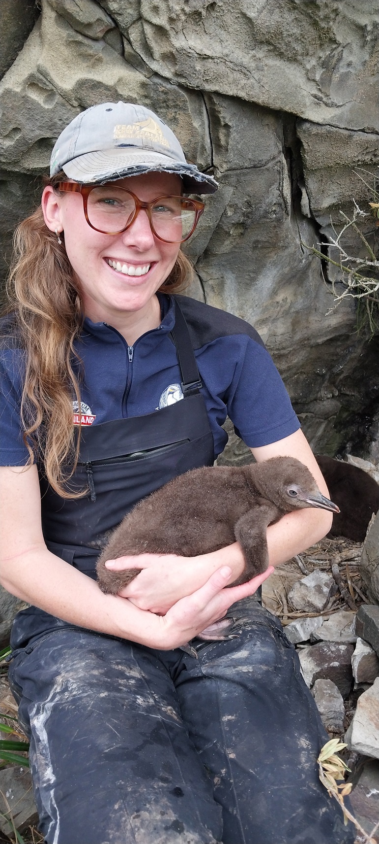 Yellow-eyed Penguin Trust biodiversity co-ordinator Francesca Neal about to hand-feed a penguin...