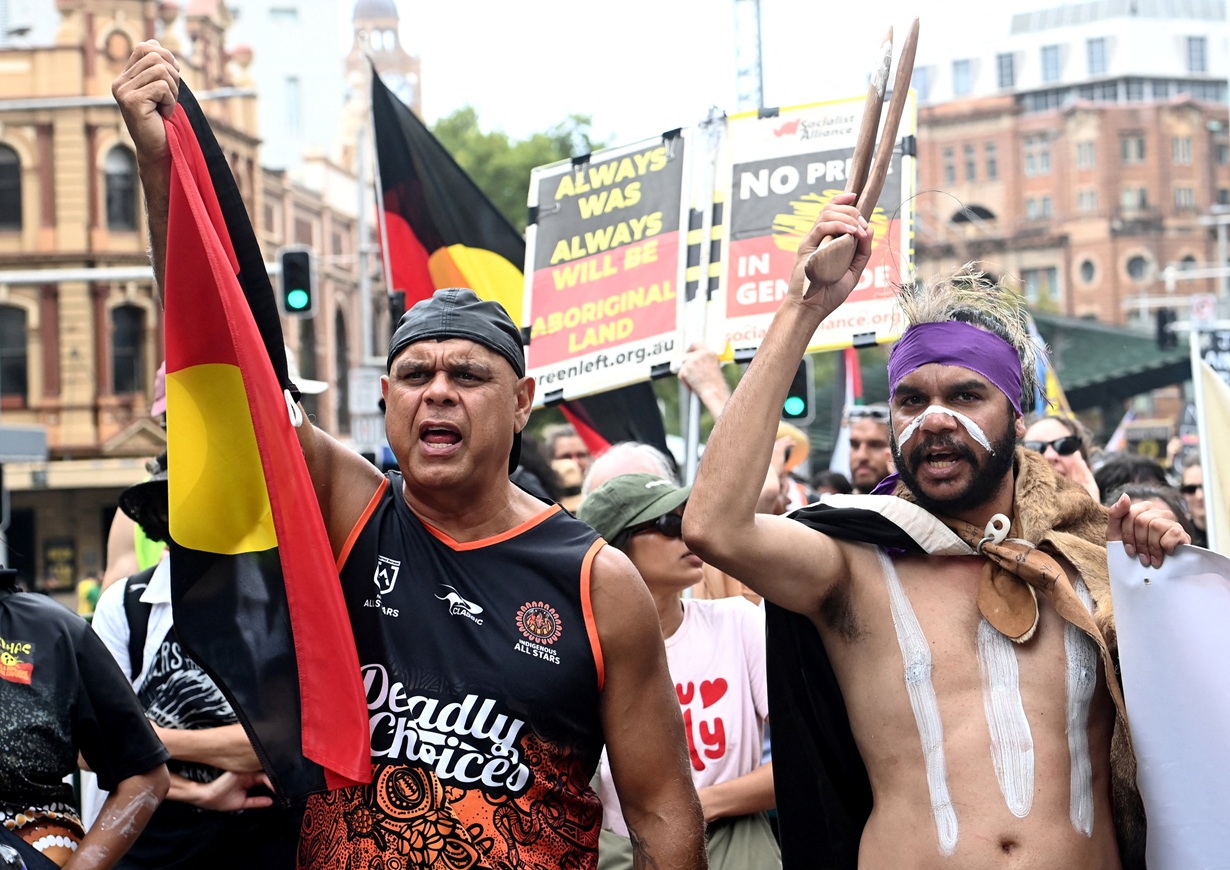 People take part in the Invasion Day protest march through Sydney on Monday. Photo: Reuters