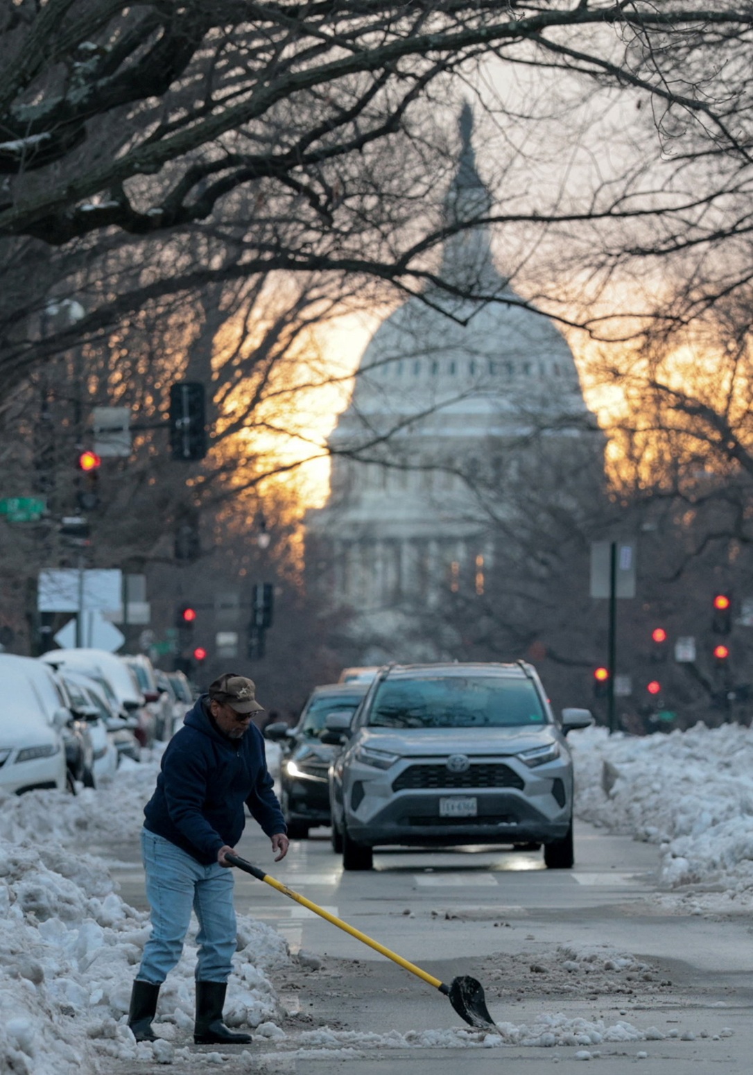 A man shovels snow near the US Capitol in Washington, DC. Photo: Reuters