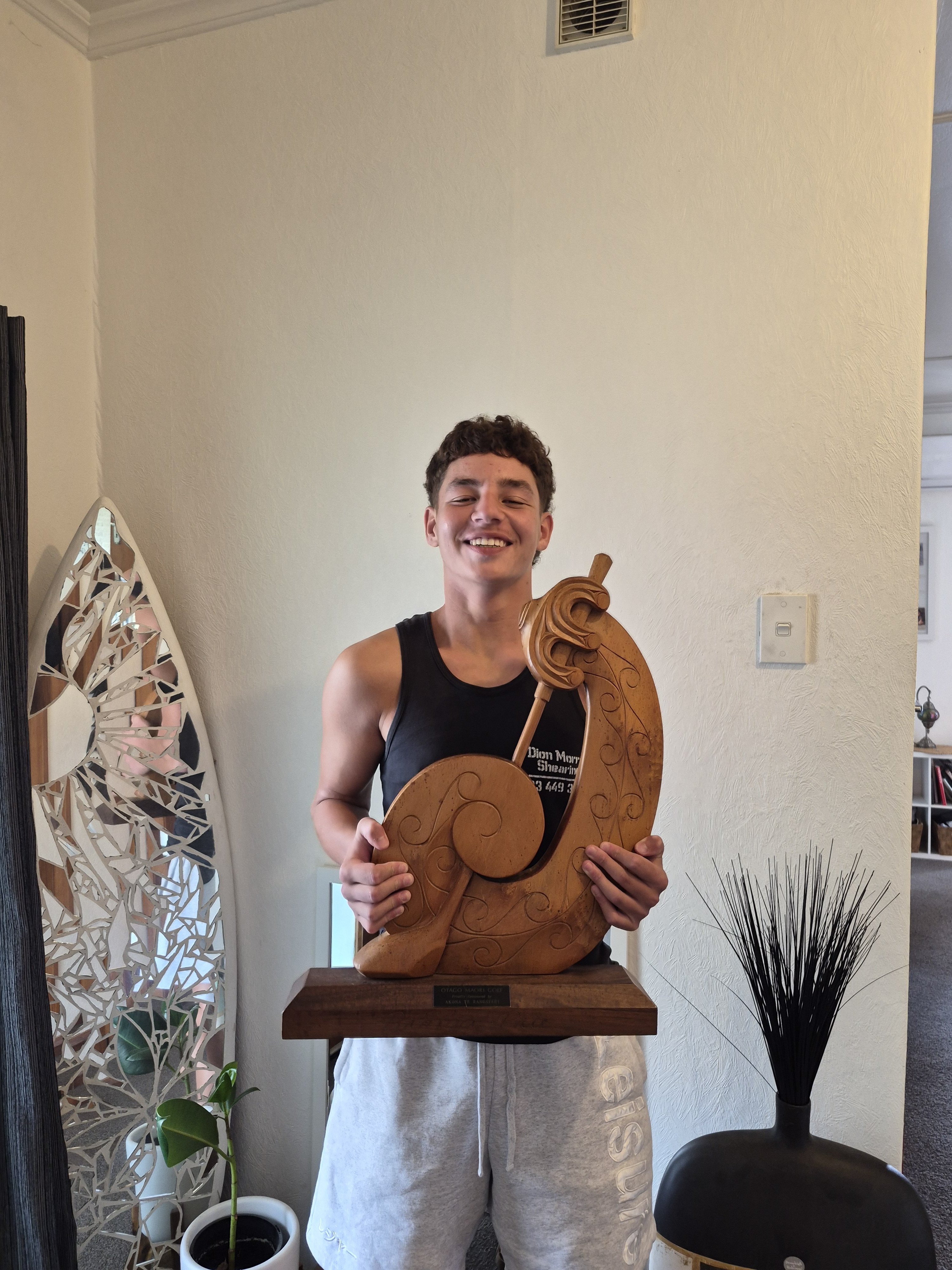 Roxburgh teenager Trey Whitu, 16, with the trophy he won at the Otago Māori Golf tournament. This...