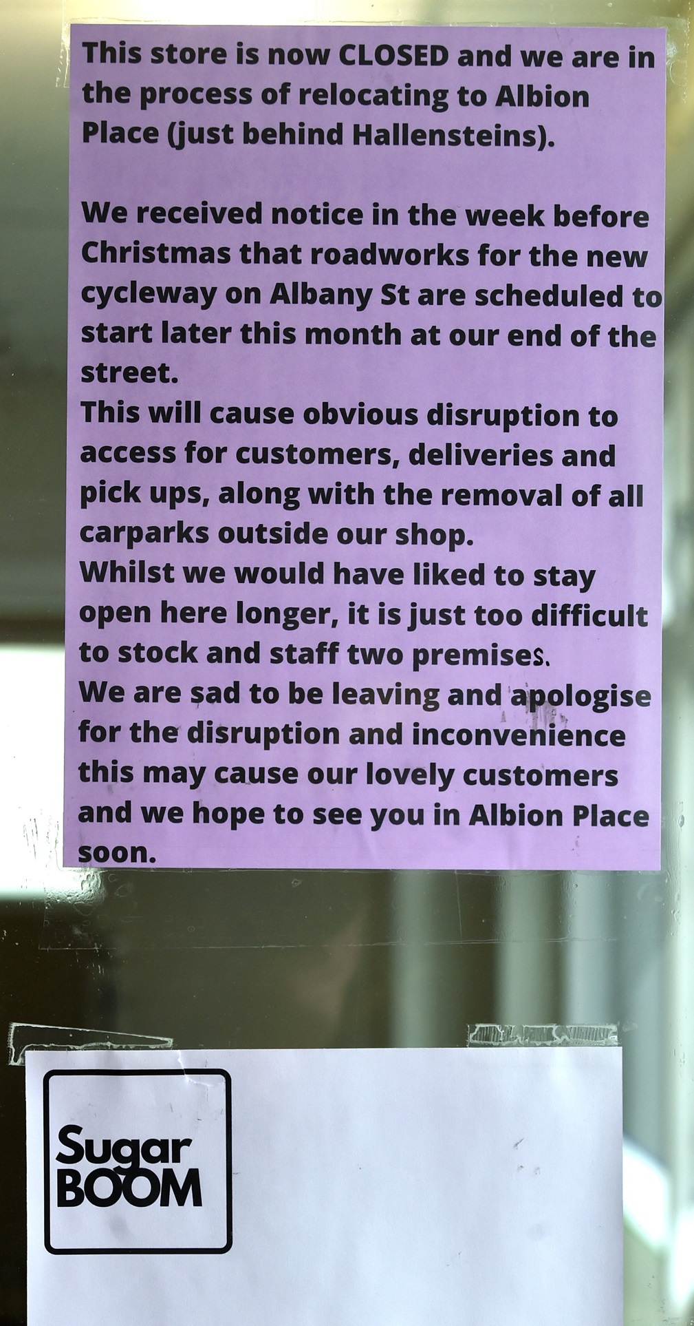 A sign in the window of Sugar Boom’s former shop in Albany St. 