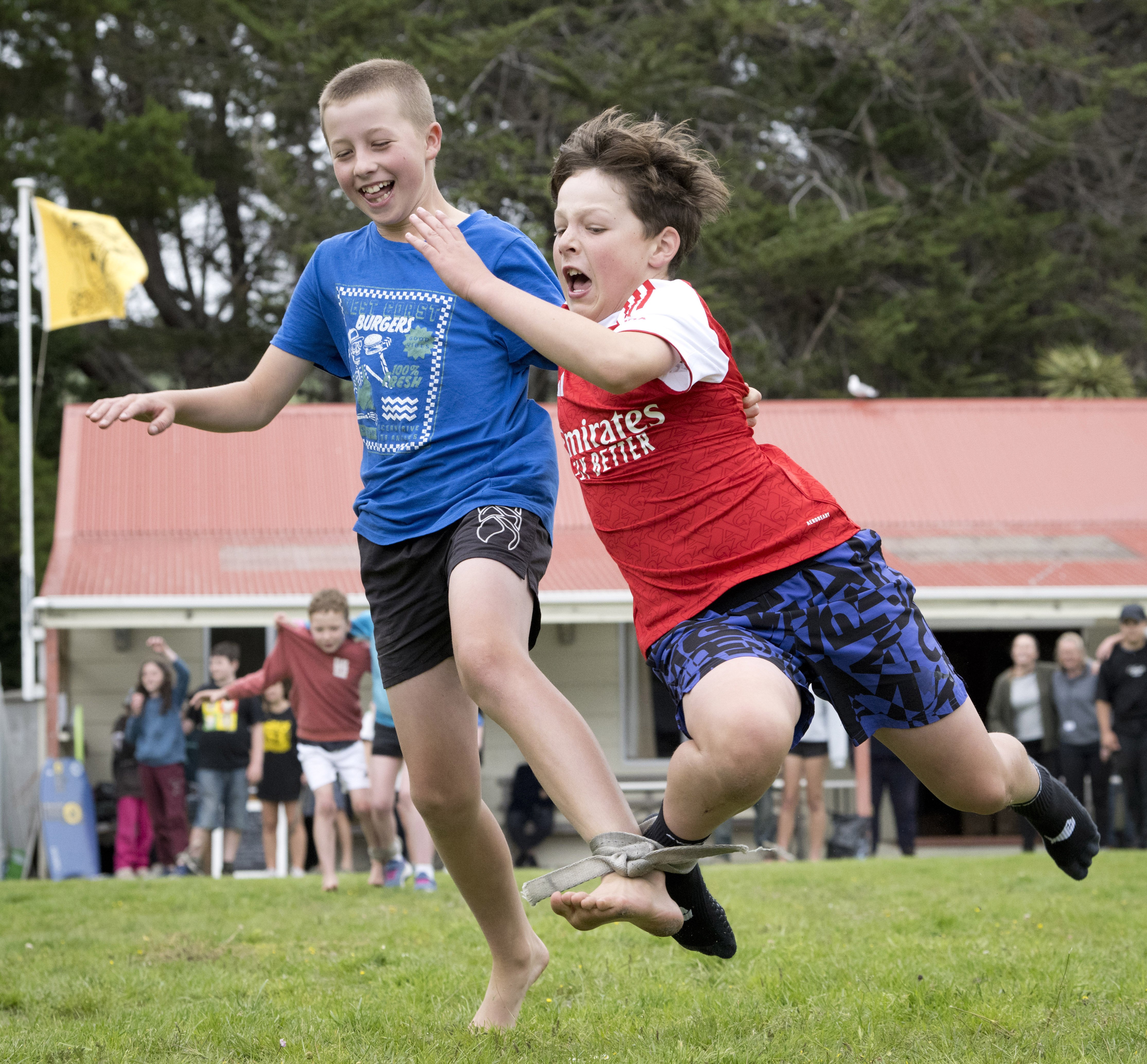 Making a run for it during a three-legged race at the Aramoana League’s sports day are George...