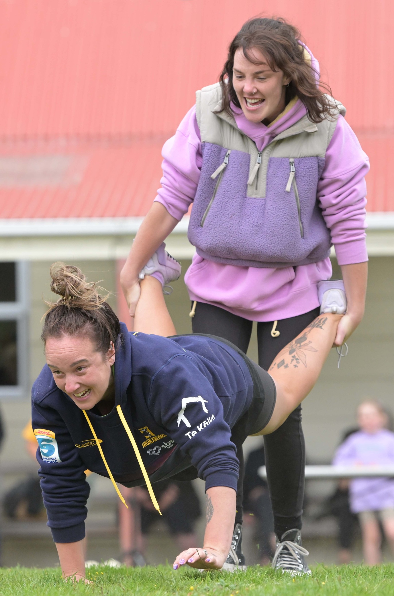 Molly Meehan carries sister Anna Meehan during a wheelbarrow race.