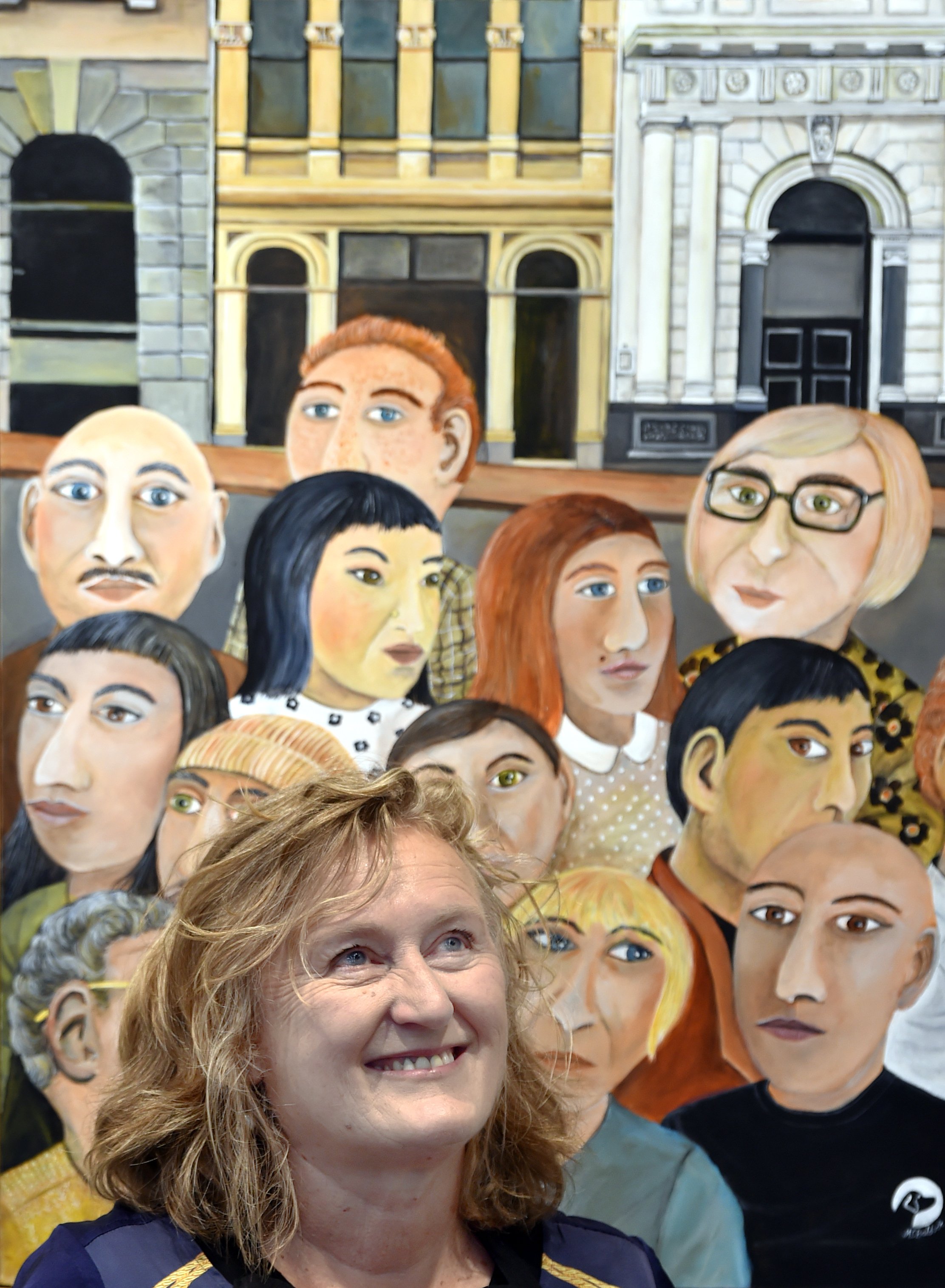 Otago Art Society president Rose Shepard in front of the acrylic painting Waiting to Open, by...