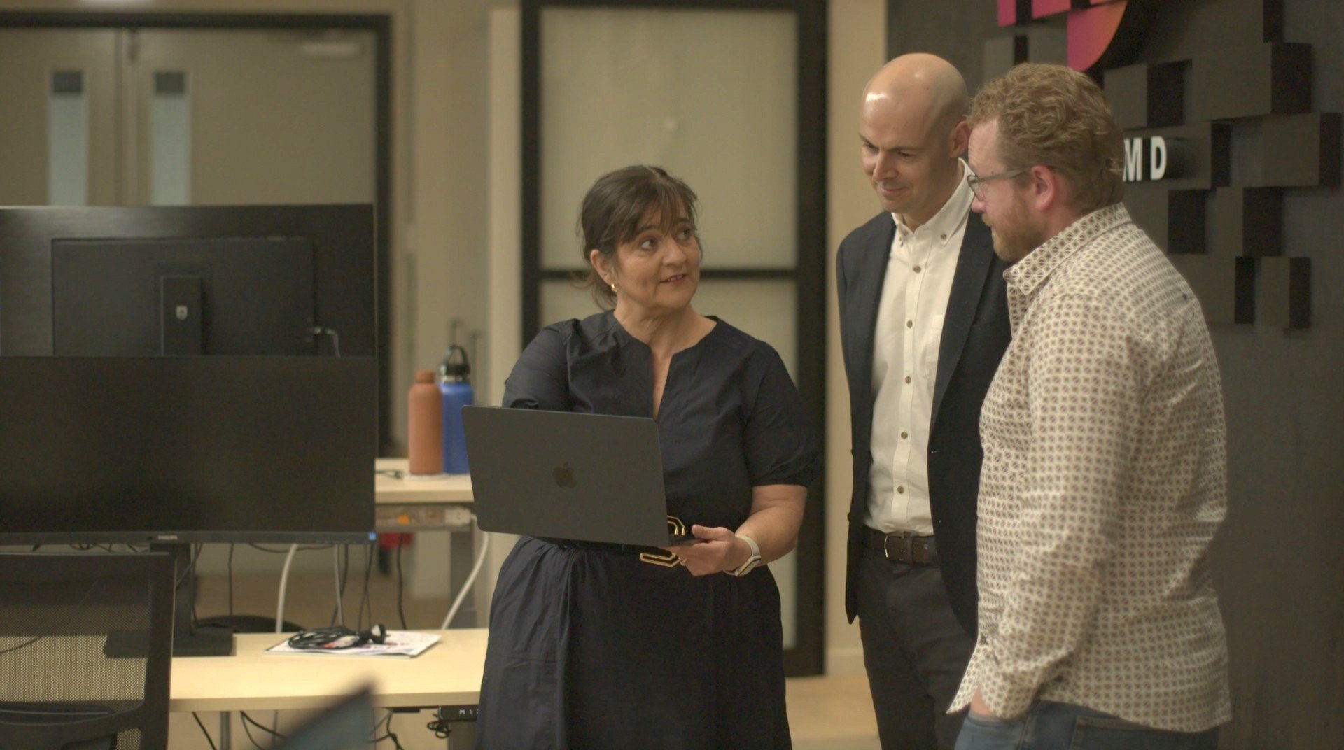 Custom D chief executive Julie Ryan talks to colleagues marketing head Matthew Rhodes (centre)...