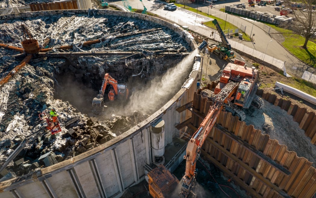 Diggers working at the burnt-out Bromley wastewater treatment plant in June 2022. Photo:...