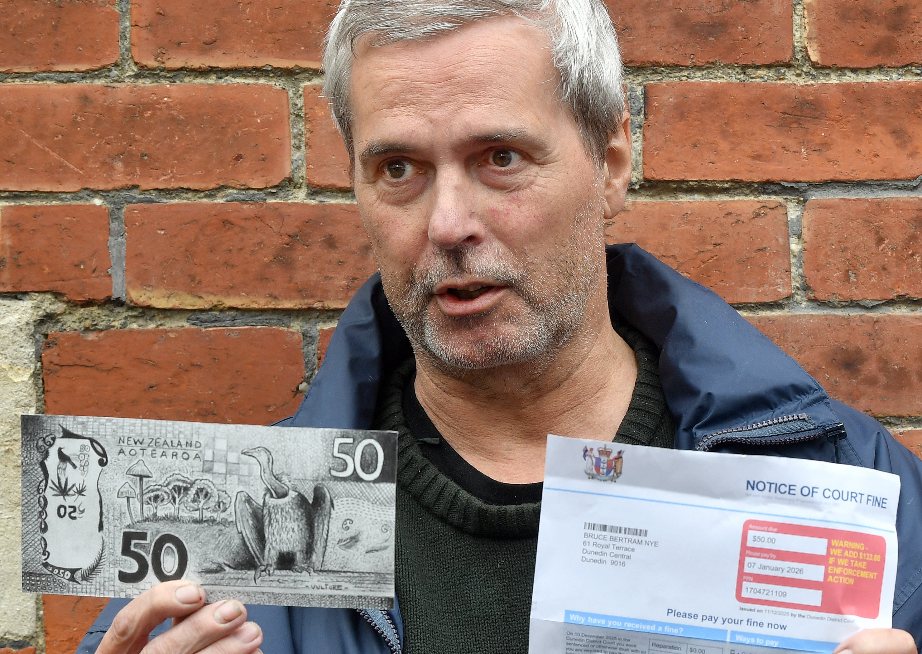 Bruce Mahalski holds the $50 note he drew to pay his court levy. PHOTO: STEPHEN JAQUIERY