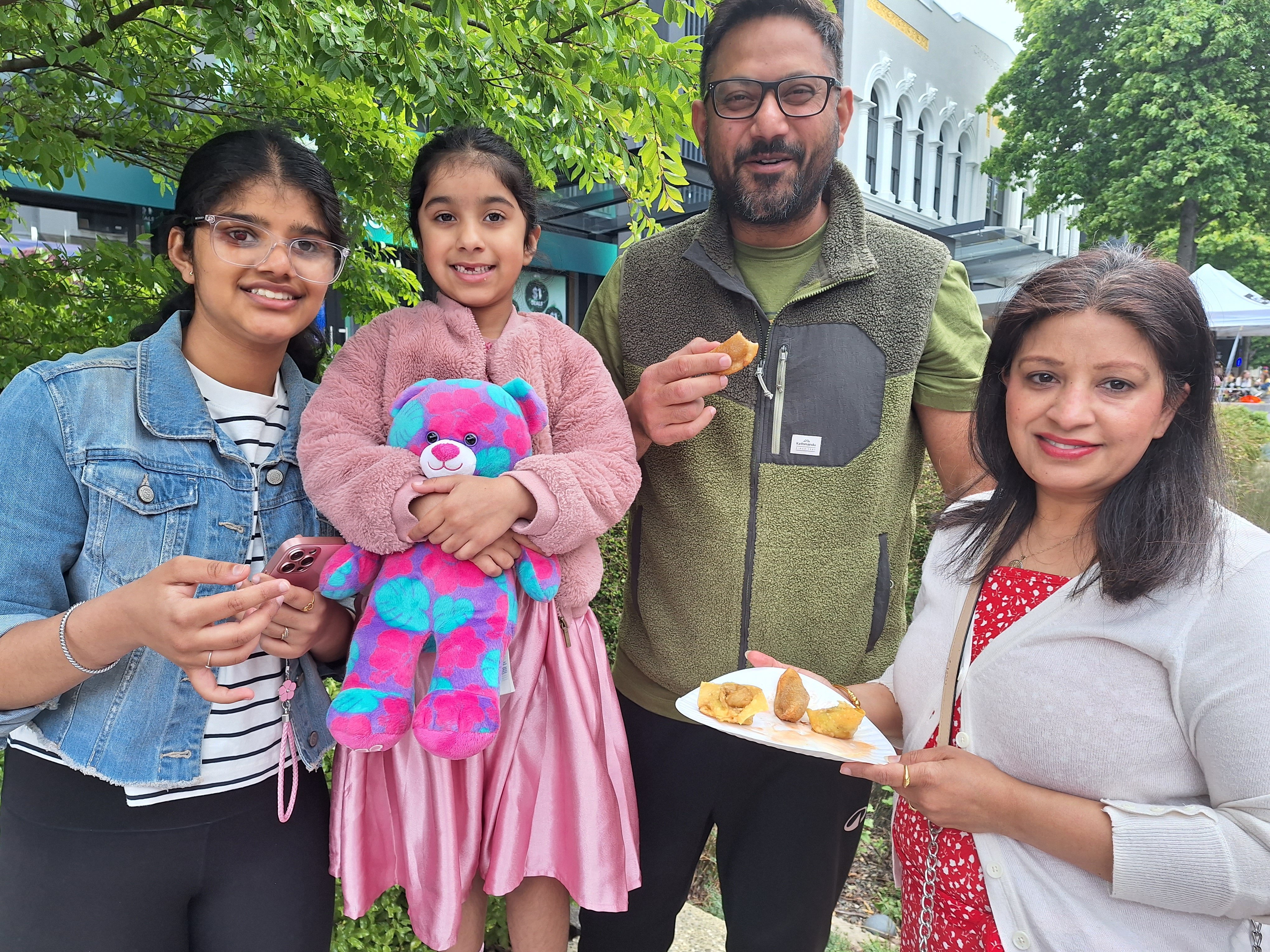 Eating wontons at the Esk St night markets on New Year’s Eve are (from left) Japnaaz, 15, Revaar,...
