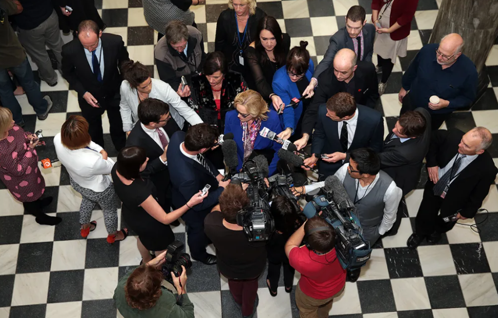 Media surround Judith Collins before she enters Parliament's Debating Chamber during the Oravida...
