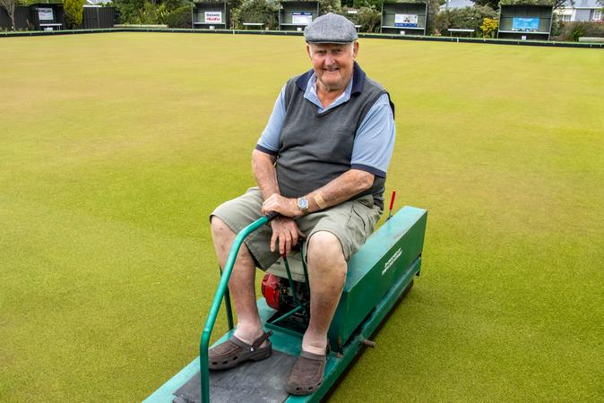 Alan Jones on the bowling green roller. Photo: Geoff Sloan