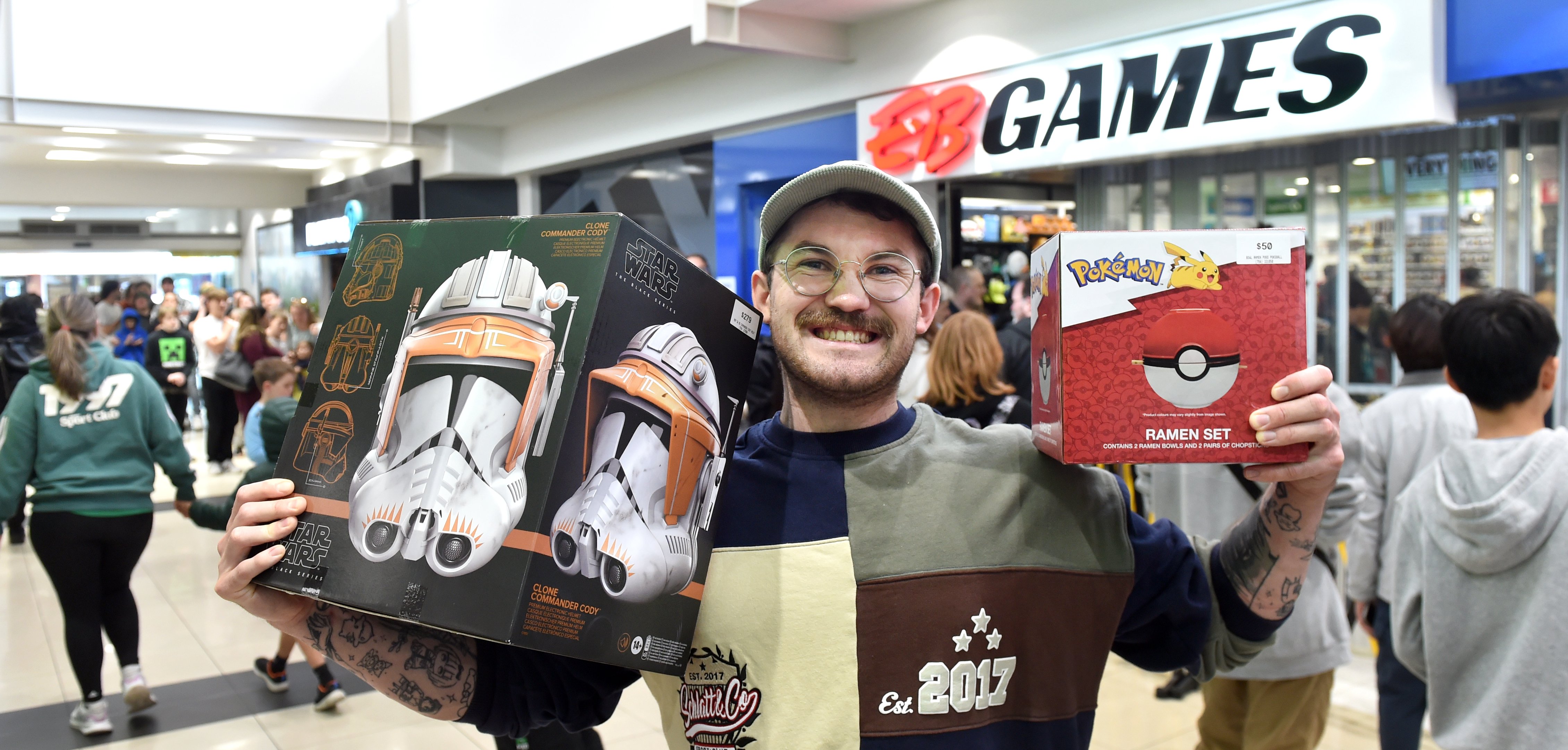 Joseph Hopkins proudly holds Commander Cody’s Star Wars helmet, which he bought for half price at...
